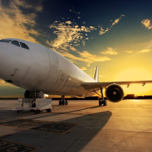 Airplane at sunset - back lit