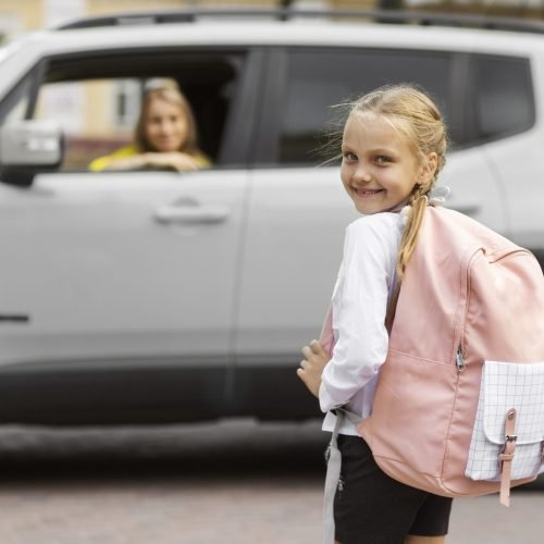 side-view-smiley-girl-going-school